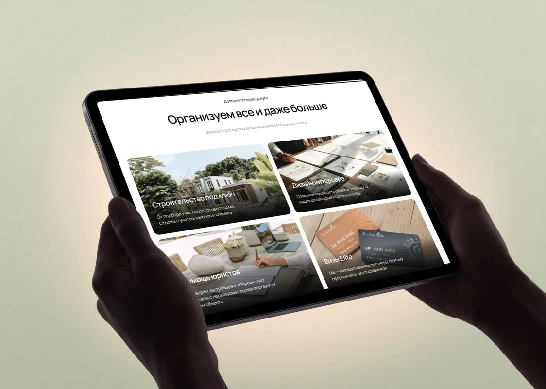 Property Library villa rental listings on a tablet held in two hands
